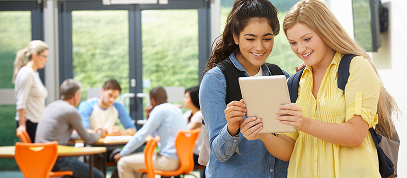 Students interacting in group, students with tablet